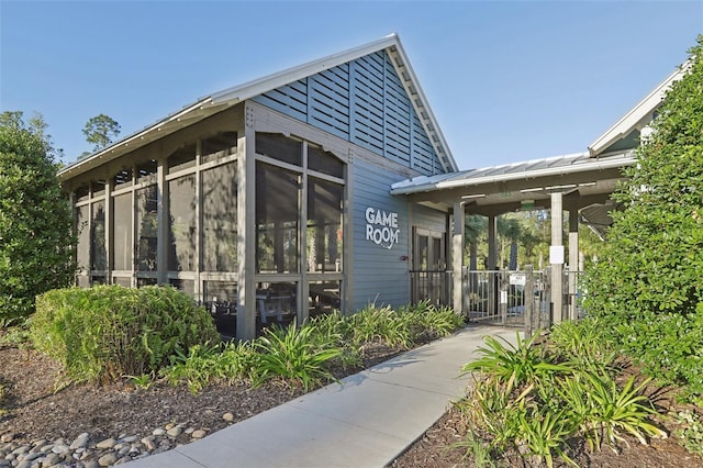 exterior space featuring a sunroom