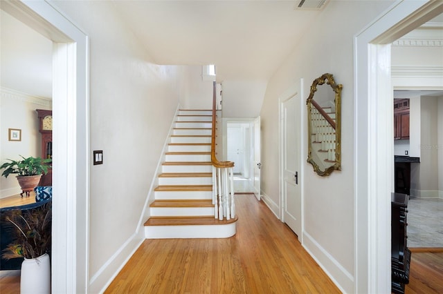 staircase featuring wood-type flooring