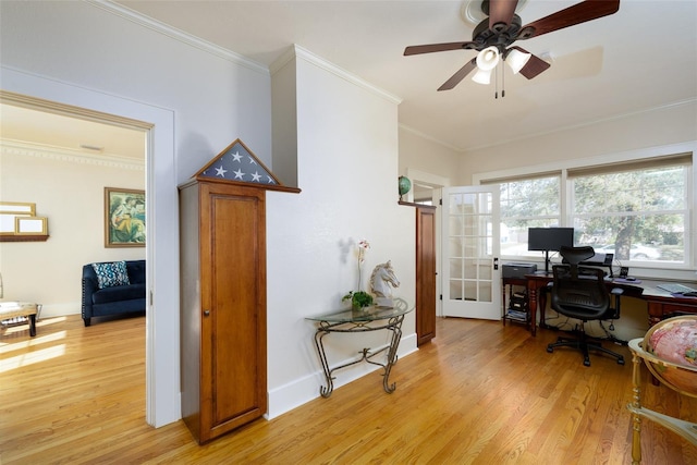 home office with ornamental molding, ceiling fan, and light hardwood / wood-style flooring