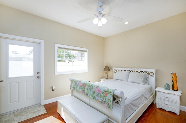 bedroom featuring hardwood / wood-style floors and ceiling fan