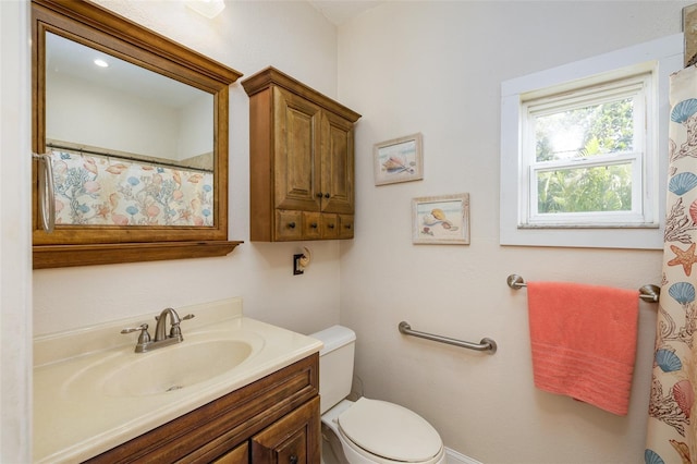 bathroom with vanity and toilet