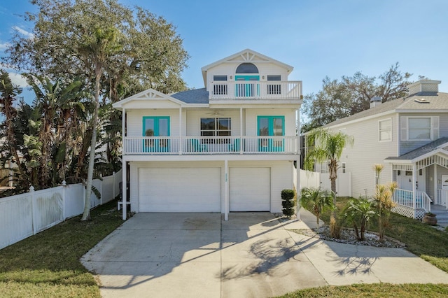 beach home with a garage and a balcony