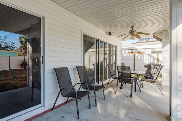 view of patio featuring ceiling fan