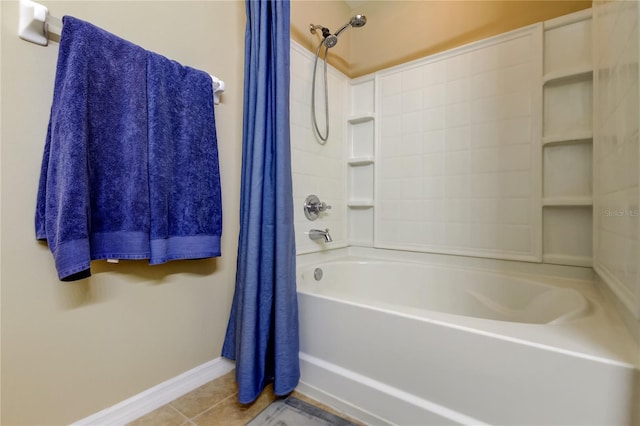 bathroom with tile patterned floors, baseboards, and shower / bathtub combination with curtain
