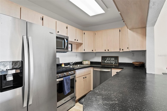 kitchen featuring sink, stainless steel appliances, and light brown cabinets