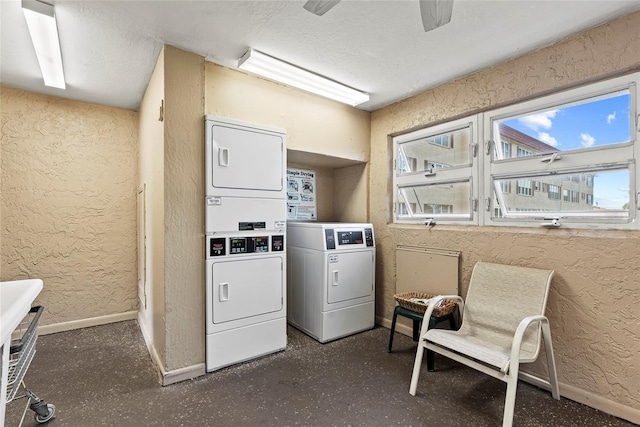 washroom with stacked washer and dryer, a textured ceiling, and ceiling fan