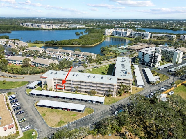 birds eye view of property with a water view