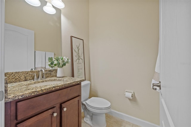 bathroom with tile patterned floors, toilet, and vanity