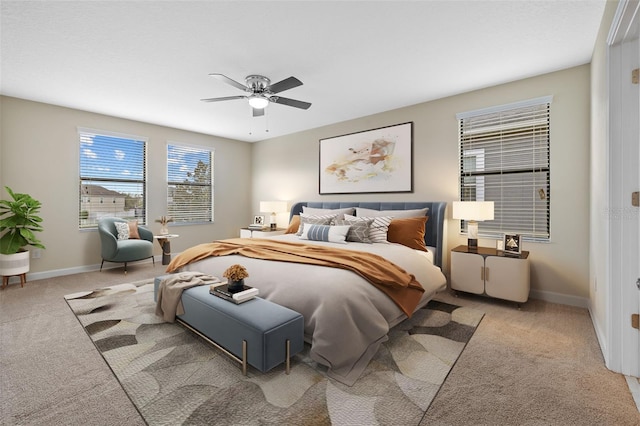 bedroom featuring light carpet and ceiling fan