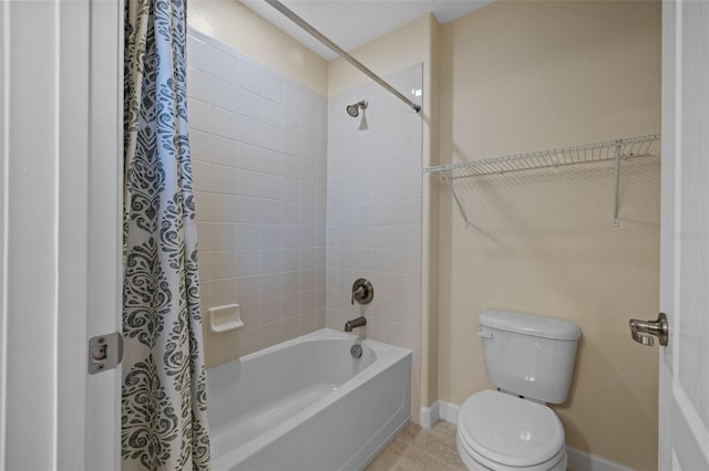 bathroom with tile patterned flooring, shower / bath combination with curtain, and toilet