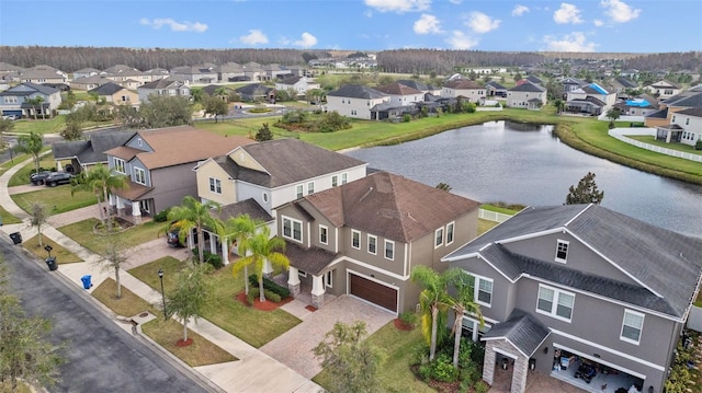 bird's eye view with a water view