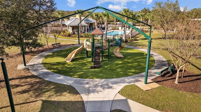 view of play area featuring a lawn