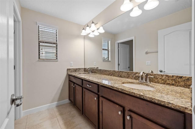 19429 Paddock View Dr, Tampa, FL 33647 - full bath featuring double vanity, plenty of natural light, baseboards, and tile patterned floors