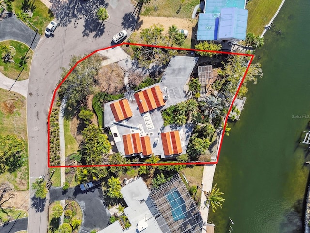 birds eye view of property with a water view