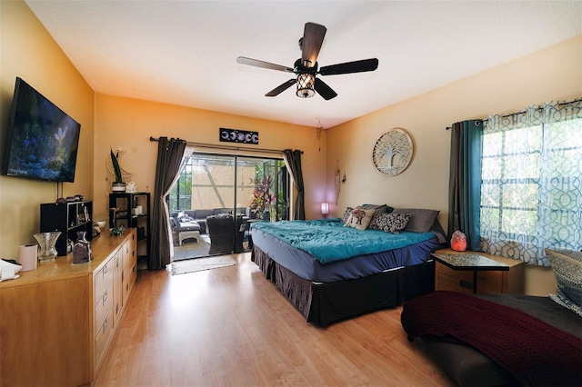 bedroom featuring ceiling fan, access to exterior, and light hardwood / wood-style floors