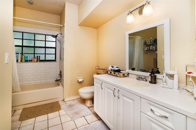 full bathroom with tile patterned flooring, vanity, shower / bath combination with curtain, a textured ceiling, and toilet