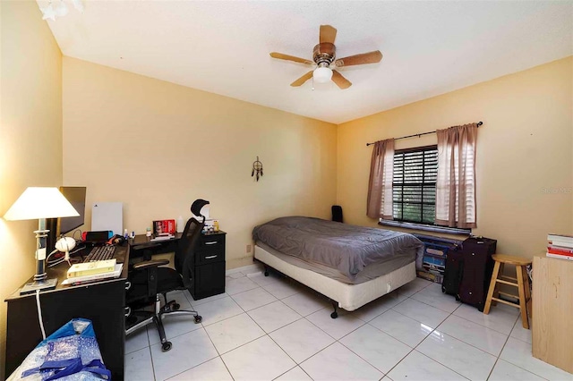 bedroom featuring light tile patterned flooring and ceiling fan