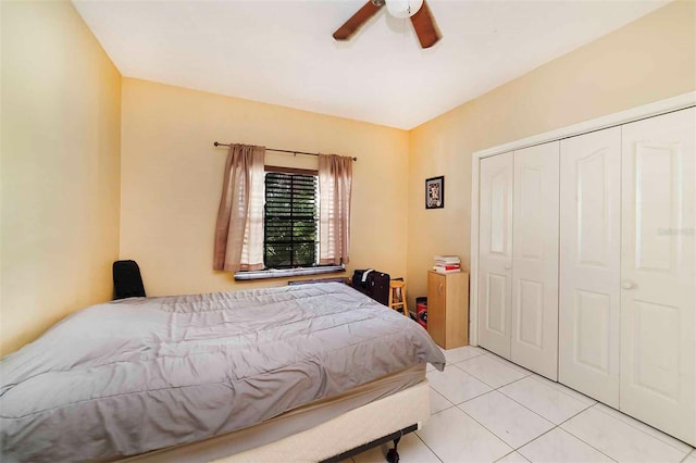 tiled bedroom with a closet and ceiling fan