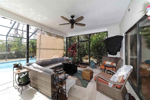 sunroom with ceiling fan