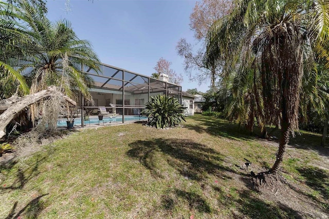 view of yard featuring a lanai