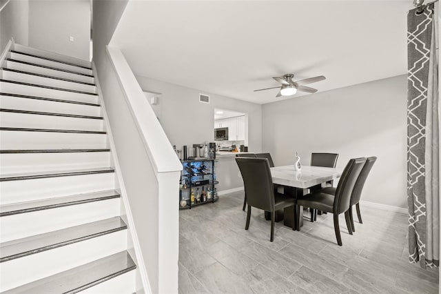 dining area with ceiling fan