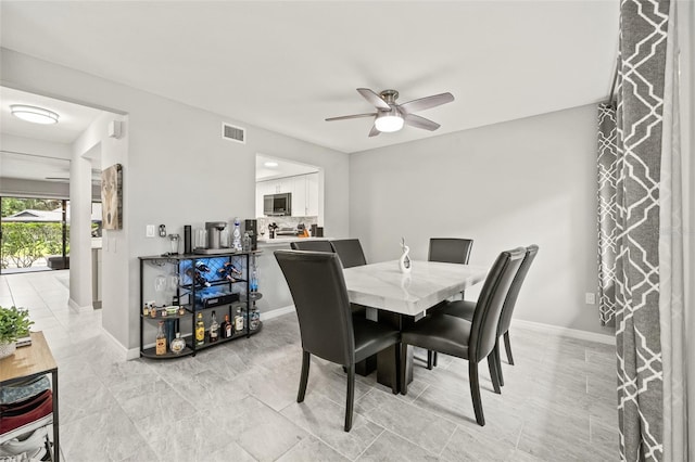 dining room with ceiling fan