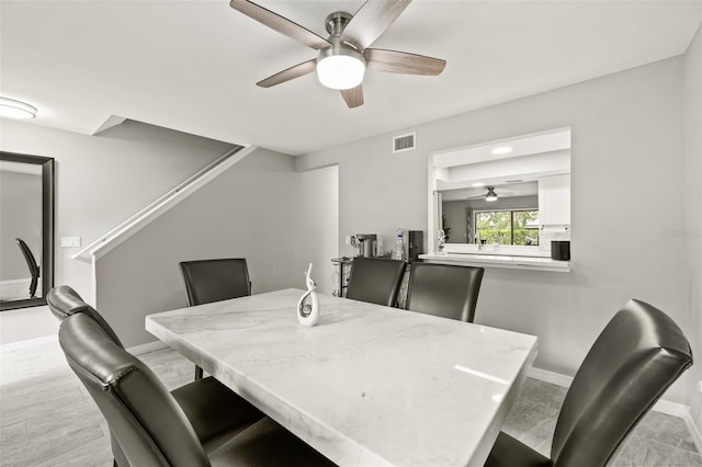 dining area with ceiling fan