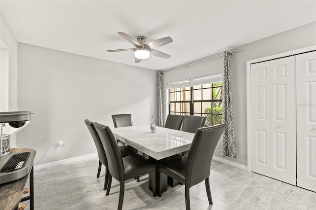 dining space featuring ceiling fan