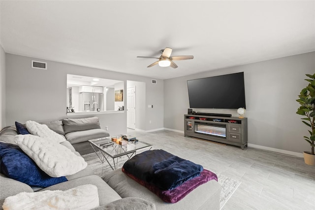 living room featuring ceiling fan