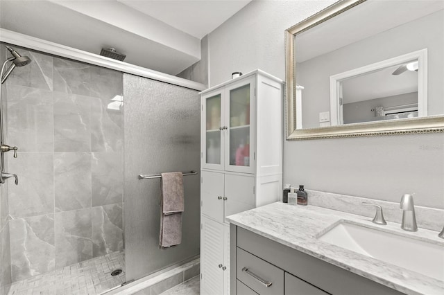 bathroom with vanity and a shower with door