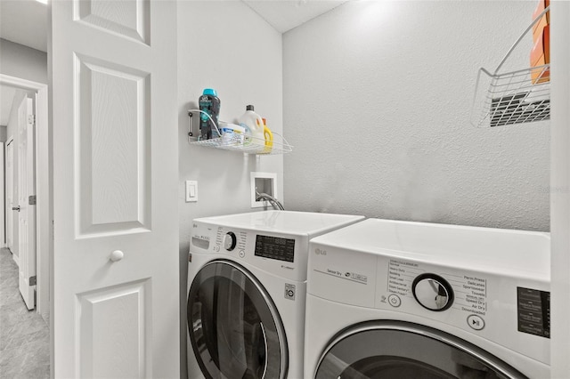 laundry area with independent washer and dryer