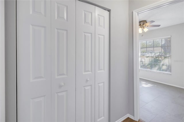 hall with tile patterned flooring