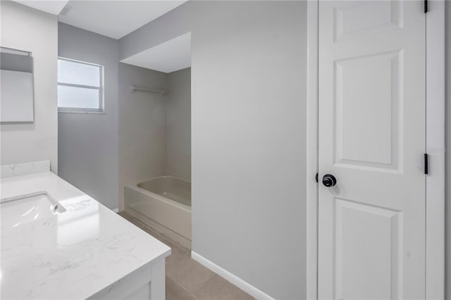 bathroom featuring vanity and a washtub