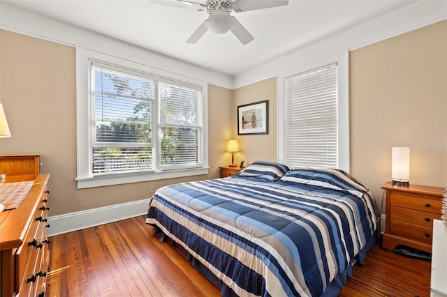 bedroom with dark wood-type flooring and ceiling fan