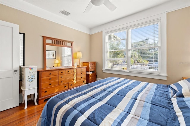 bedroom with dark wood-type flooring and ceiling fan