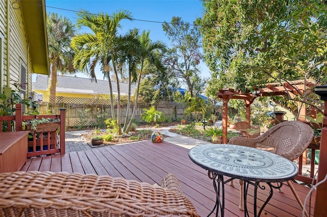 wooden deck featuring a pergola