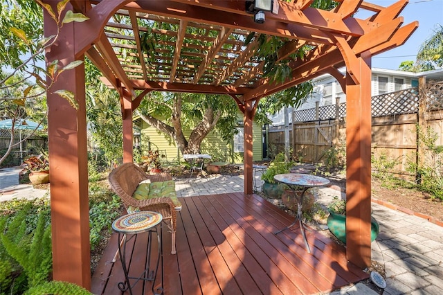 wooden terrace with a patio and a pergola