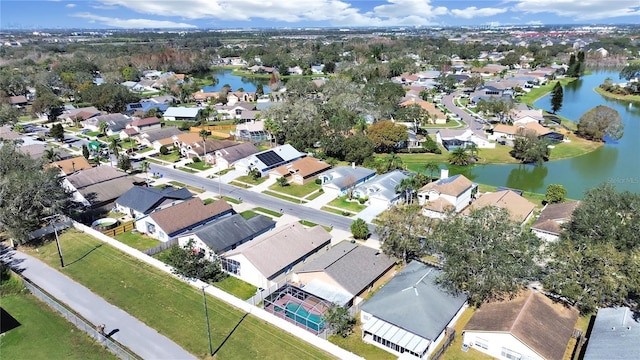 drone / aerial view with a residential view and a water view