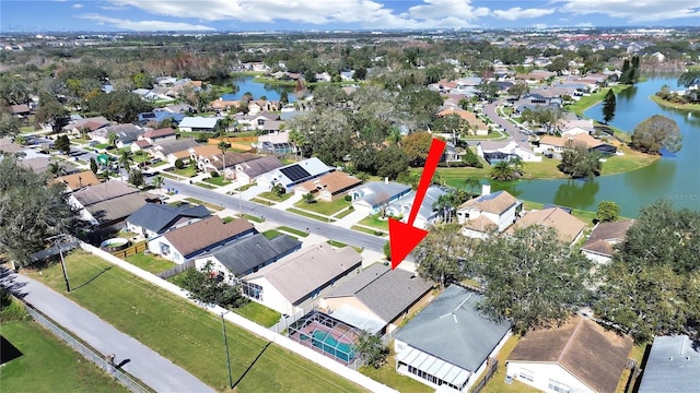 bird's eye view with a water view and a residential view