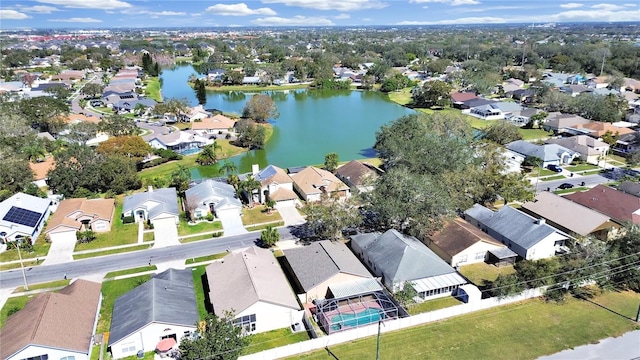 bird's eye view with a residential view and a water view