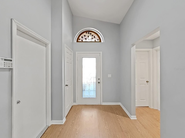 entryway featuring light wood finished floors and baseboards