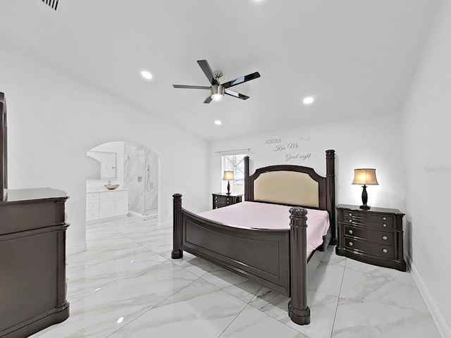 bedroom featuring arched walkways, marble finish floor, and recessed lighting