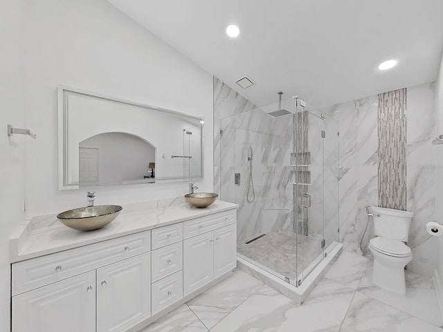 full bathroom with toilet, marble finish floor, a sink, and a marble finish shower