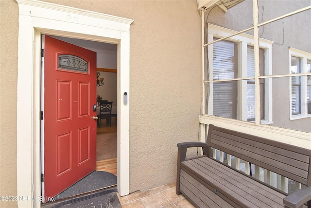 entrance to property featuring a balcony