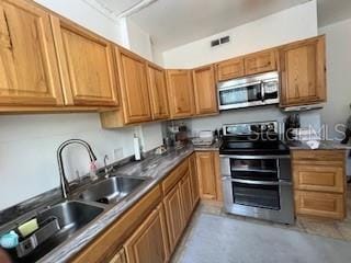 kitchen featuring stainless steel appliances and sink