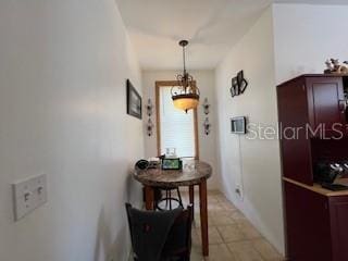 hallway with light tile patterned floors