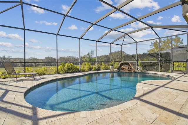 outdoor pool featuring a lanai and a patio area