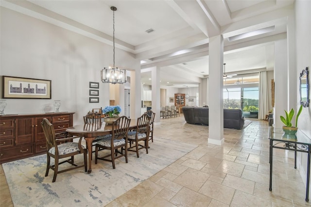 dining area with baseboards, visible vents, a notable chandelier, and stone tile floors