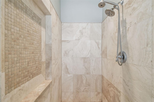 bathroom featuring tiled shower