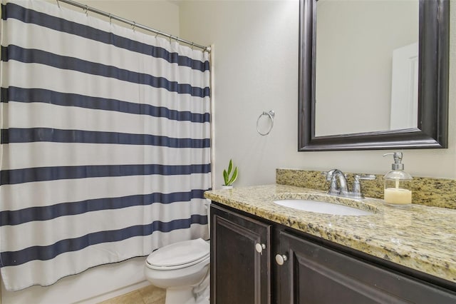 full bathroom featuring toilet, tile patterned floors, and vanity